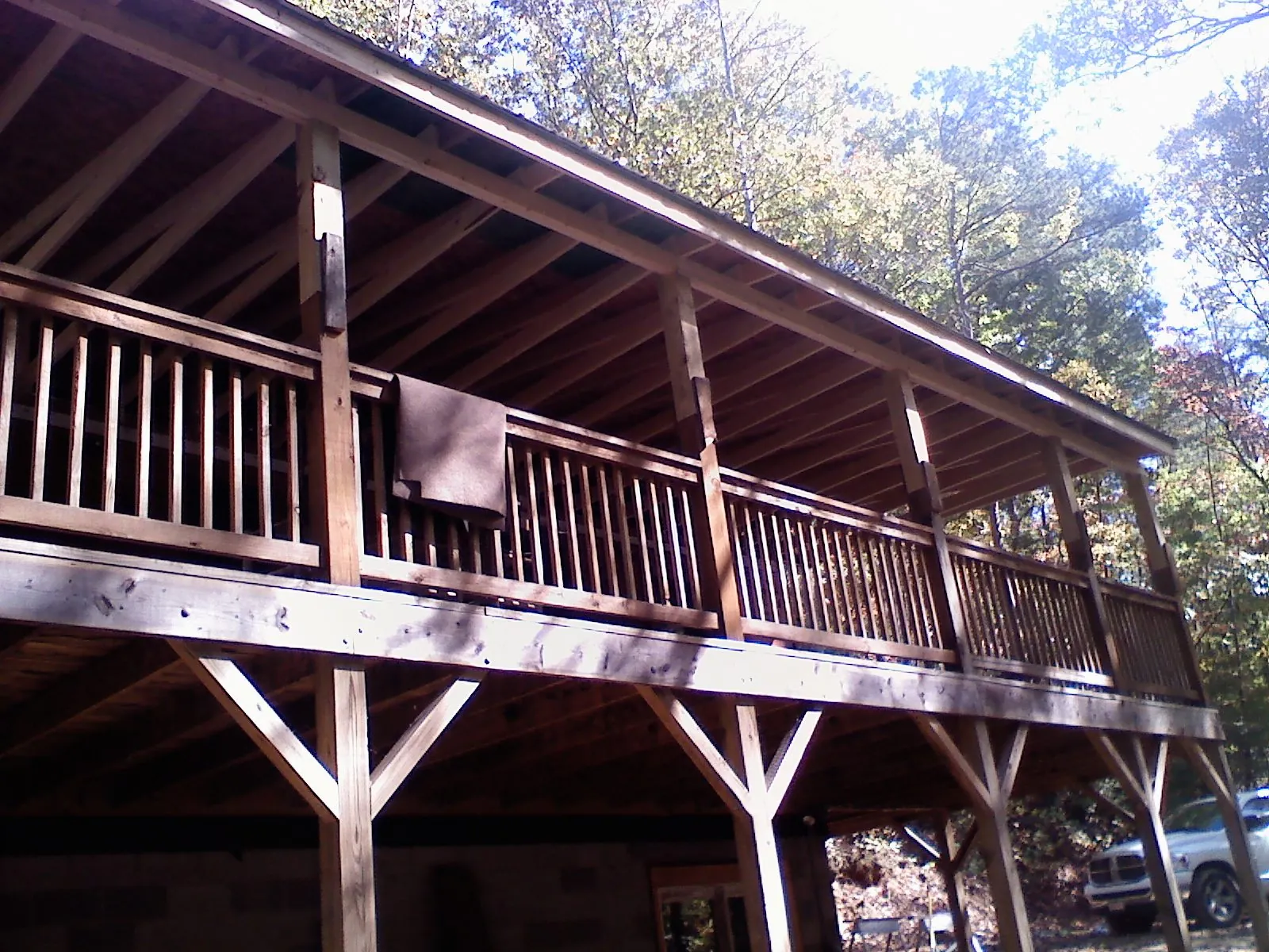 Timber framing under a new elevated porch and deck — Roof Leak Repair in Babson Park by Roofing Brothers
